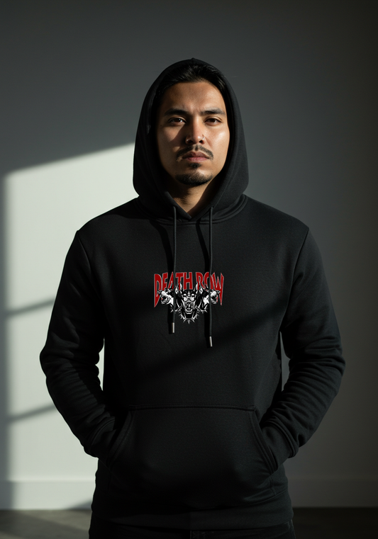 Person wearing a black hoodie with a graphic design on a dark background